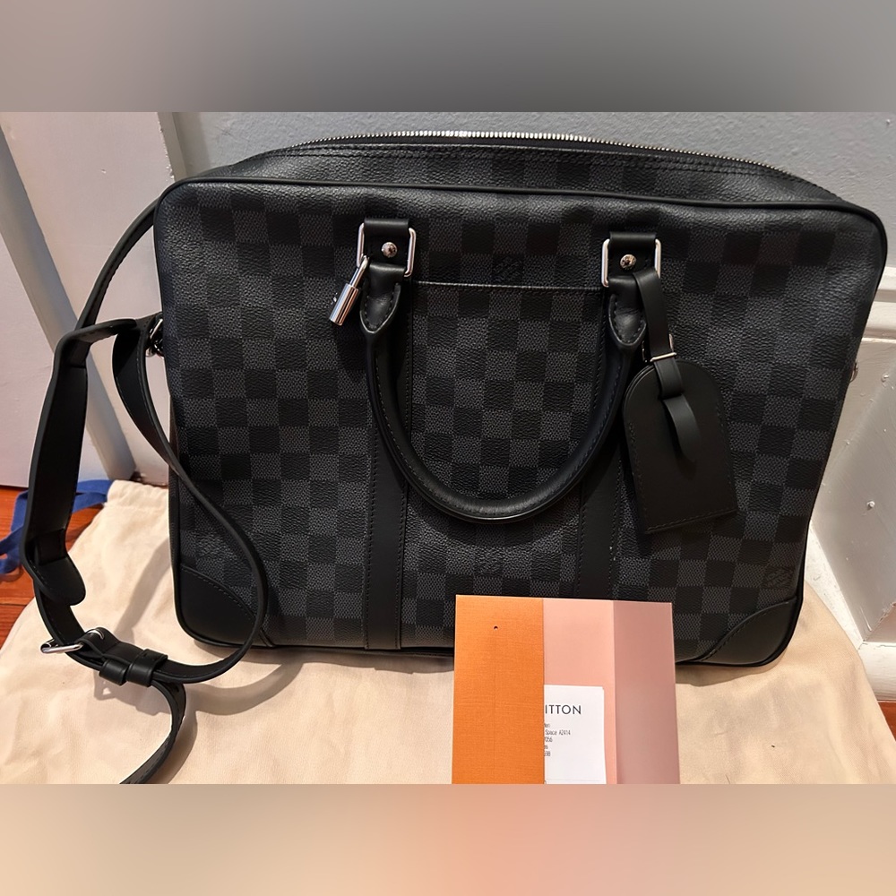 Never used Louis Vuitton computer bag/briefcase or Porte-Documents Voyage.